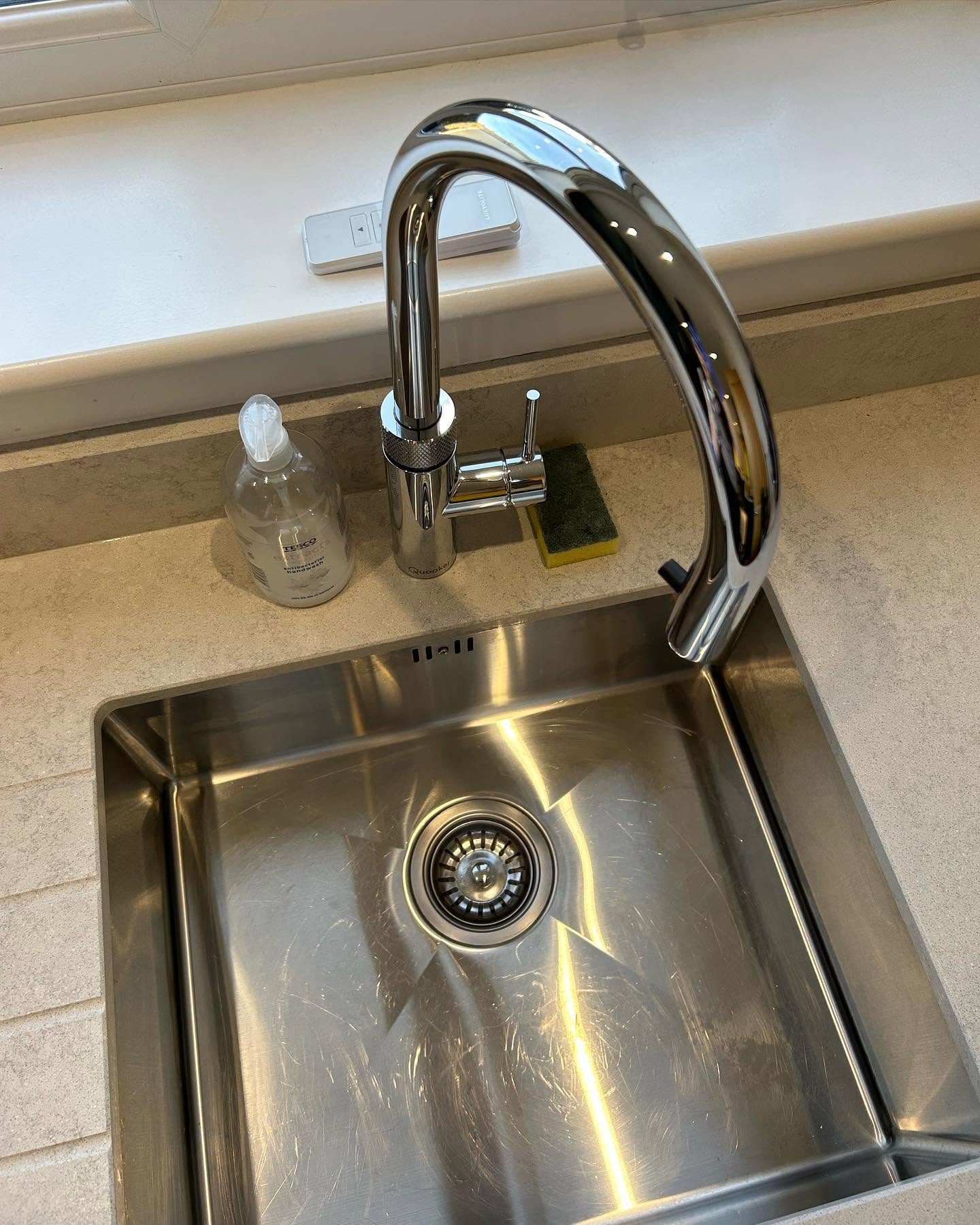 Polished kitchen tap and countertop