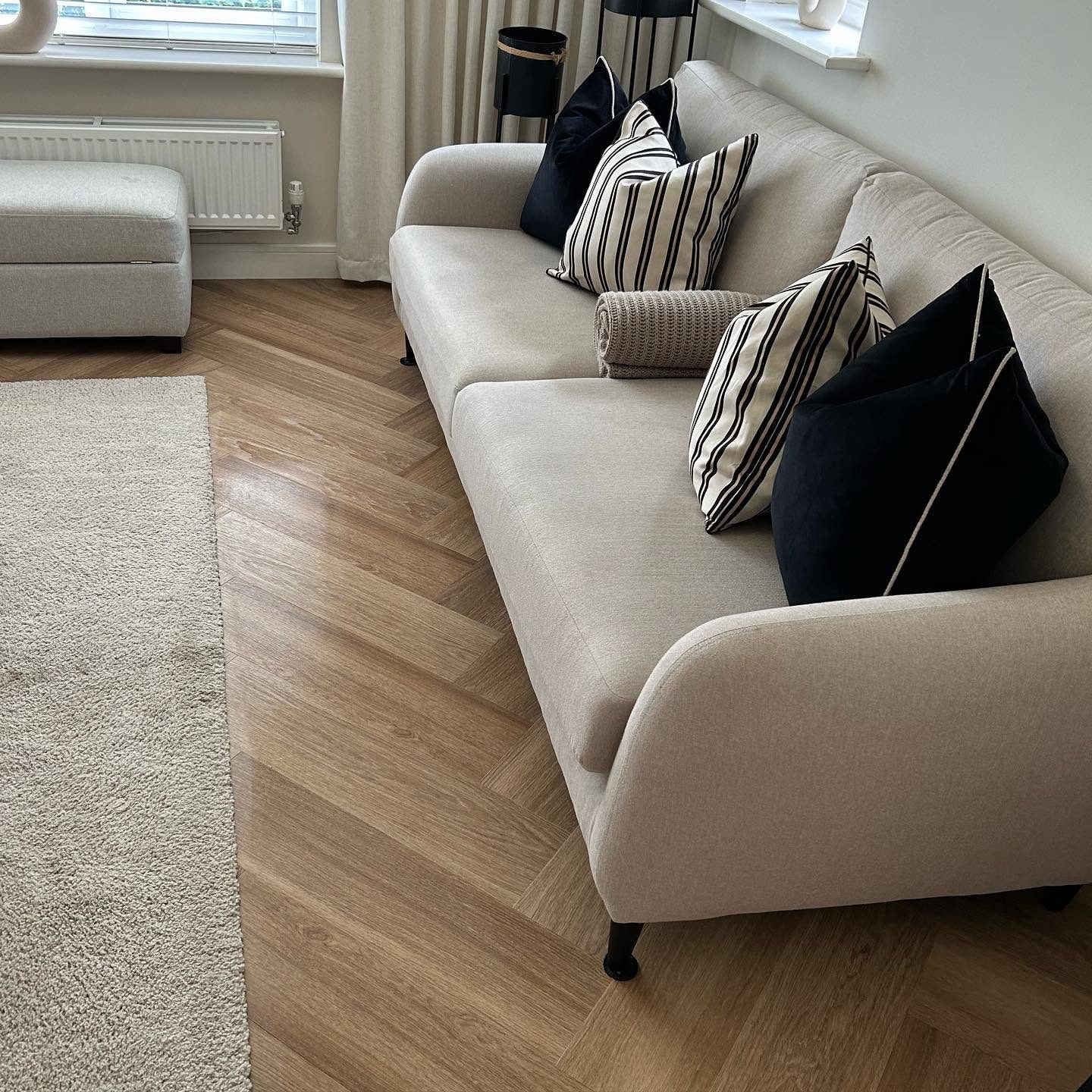 Sofa and herringbone floor